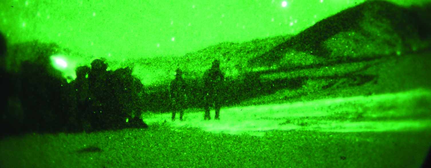 Image of a night time operation to arrest a Taliban leader.